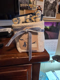 Cozy Gift Basket Set with fuzzy socks and mittens tied with silver ribbon
